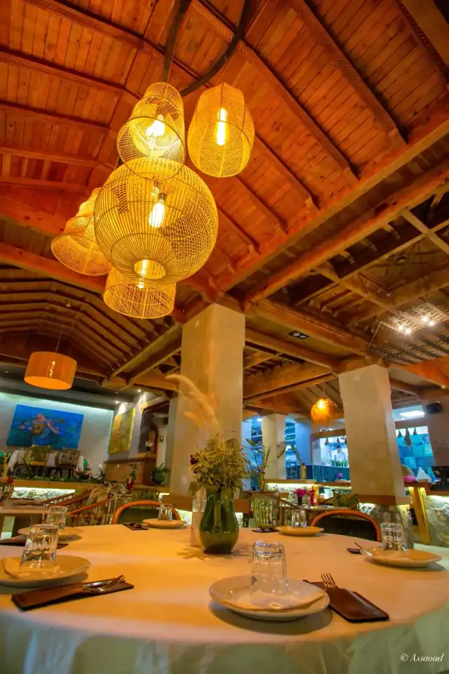 Warm lantern-lit dining room interior at Triana Chefchaouen