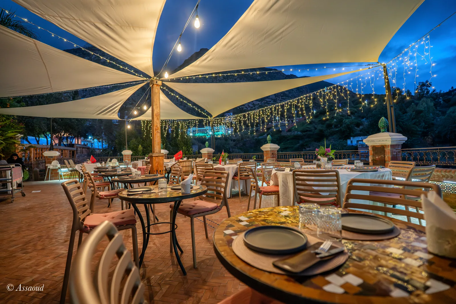 Dinner guests at Triana rooftop in Chefchaouen January evening